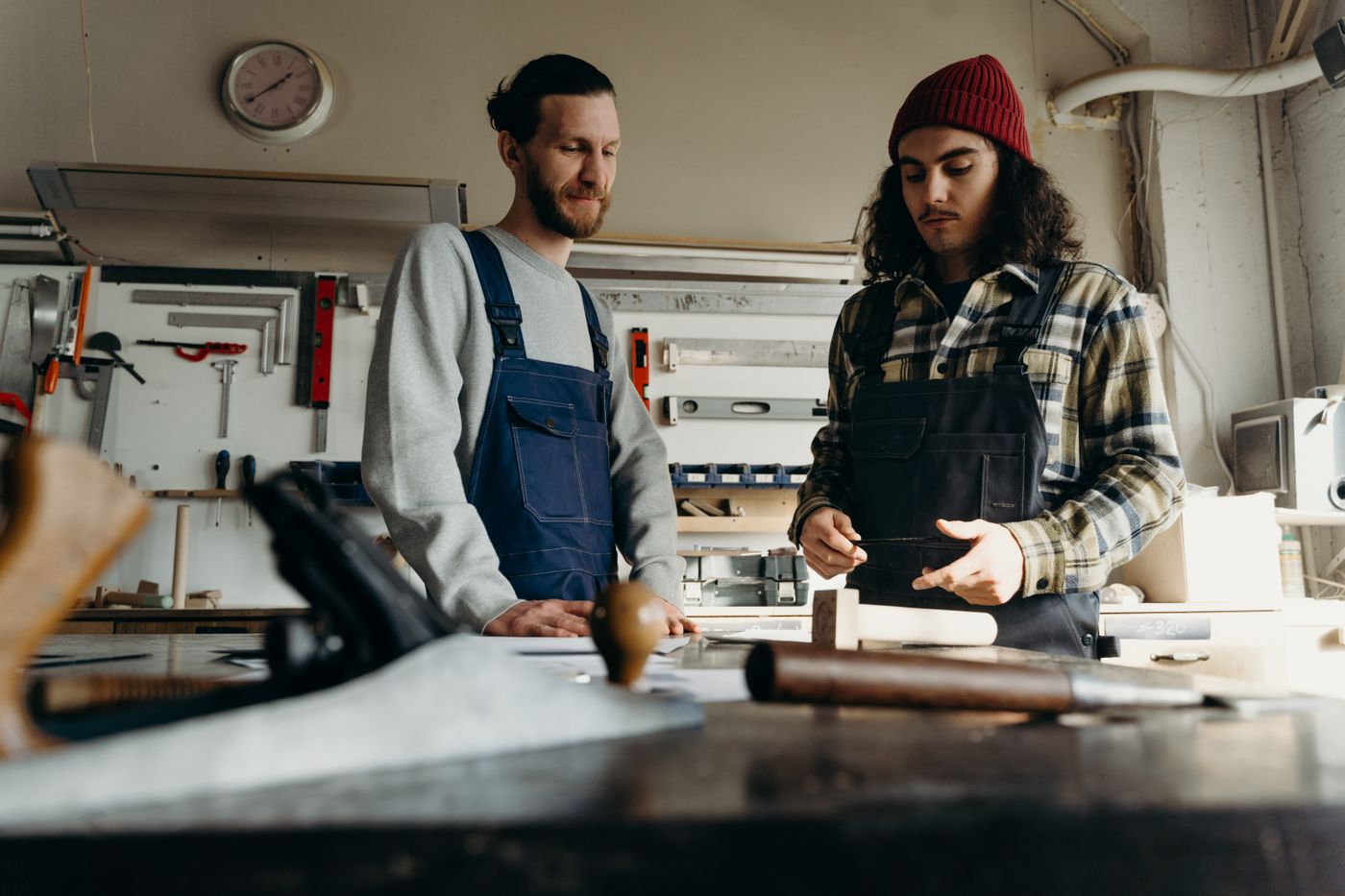 Two joiners working in a fitted out workspace